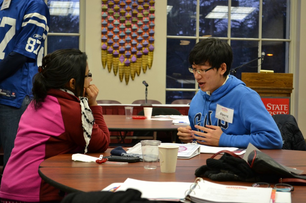 Luna Kc (left) and Ziyang Yu discuss campaign issues and strategies.