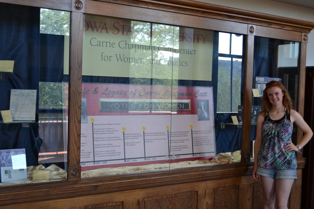 Sarah Synovec in front of the display case outside the Axel Conference Center, Room 302 Catt Hall.