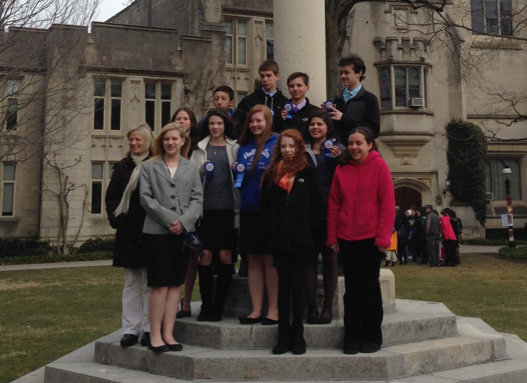 Emma Anmolsingh (pink jacket, far right) poses with her classmates after regionals at Princeton University.
