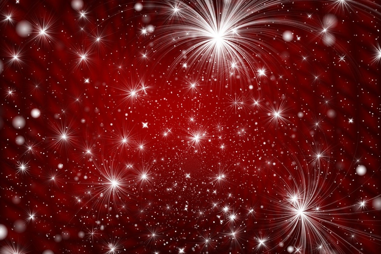 Stars and fireworks on a red background