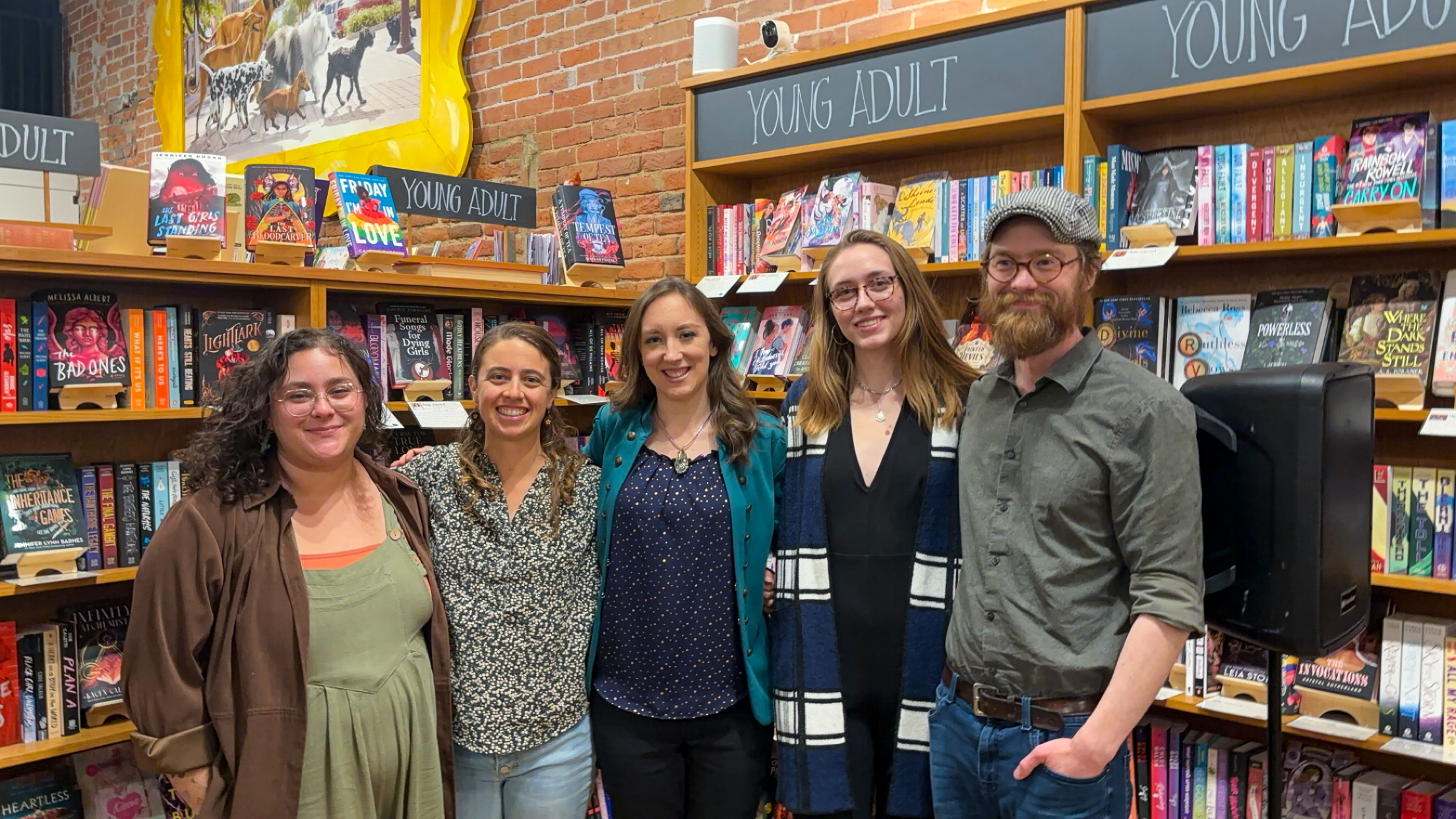 Group of people at Dog Eared books in Ames smiling