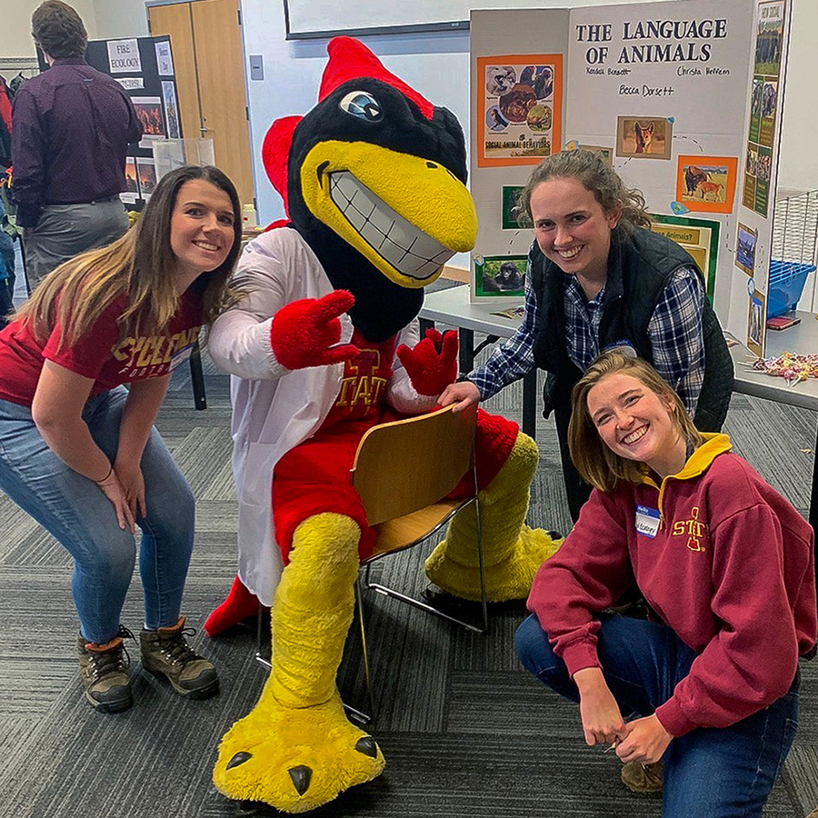 Group of students smiling with mascot Cy