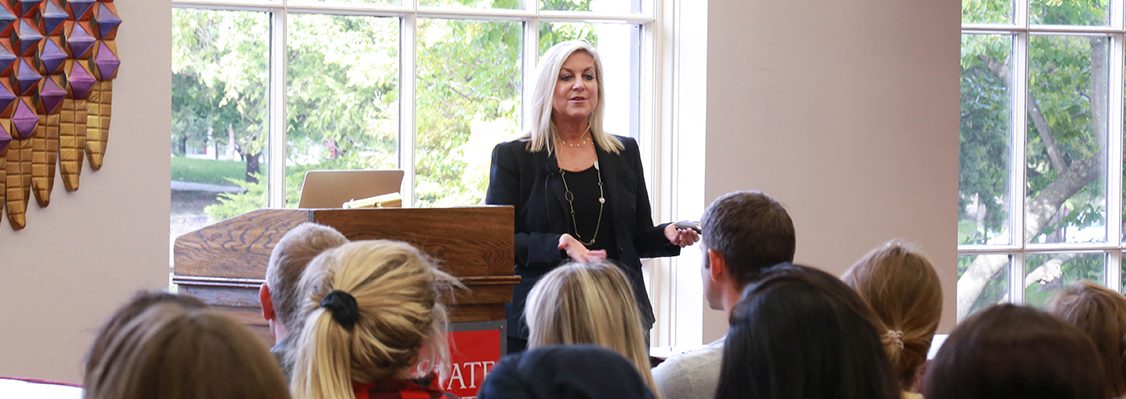 Kim Guthrie presents in front of a group of students at the Memorial Union.