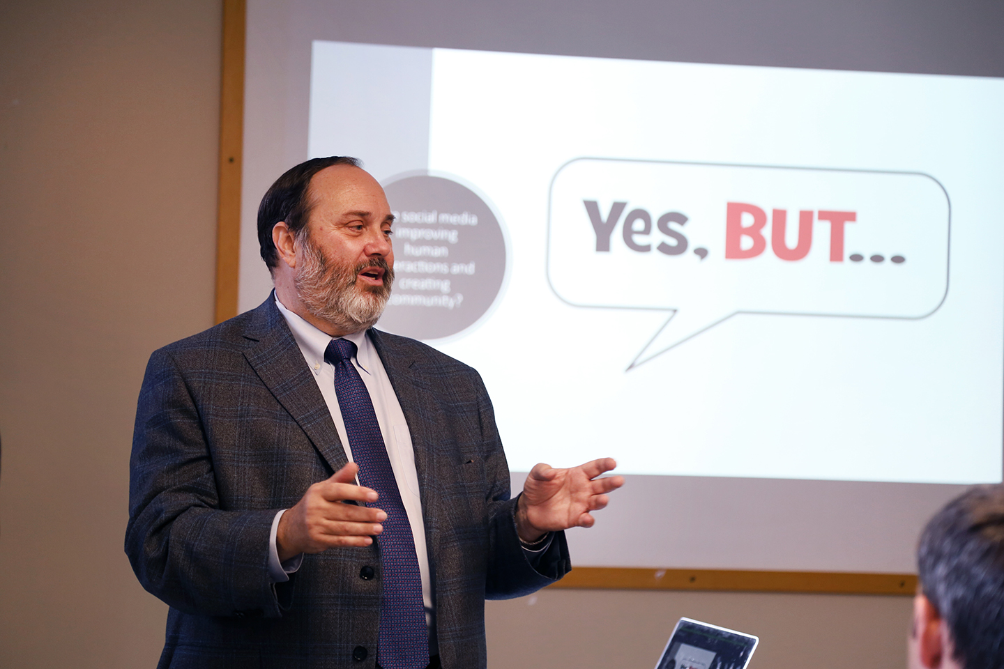 Robert Picard presents in 172 Hamilton Hall with a Powerpoint slide on the screen that says "Yes, But" behind him
