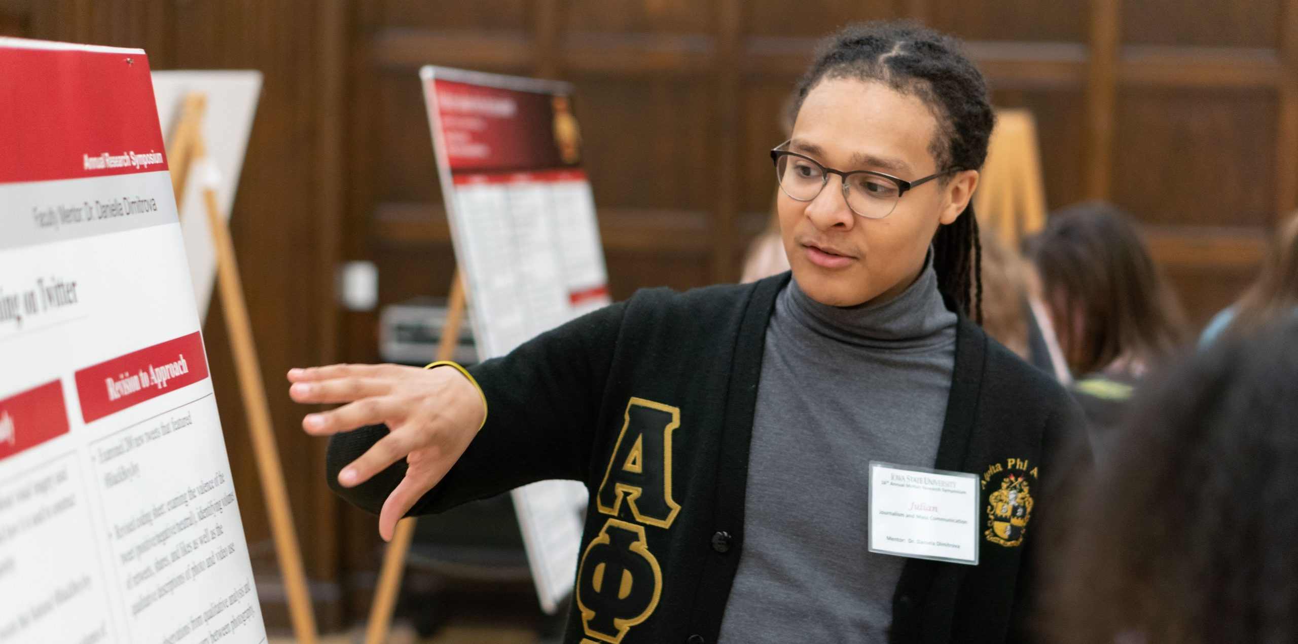 student presents research poster in Memorial Union