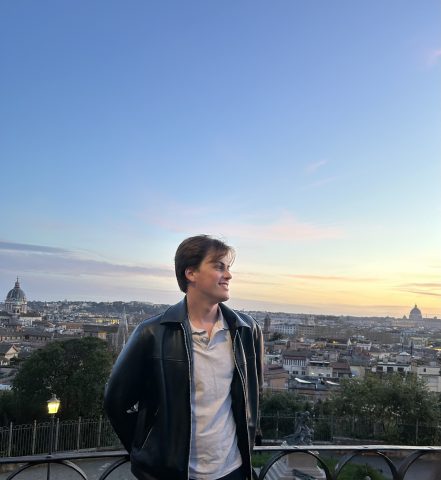 Student posing with Rome, Italy in the background.