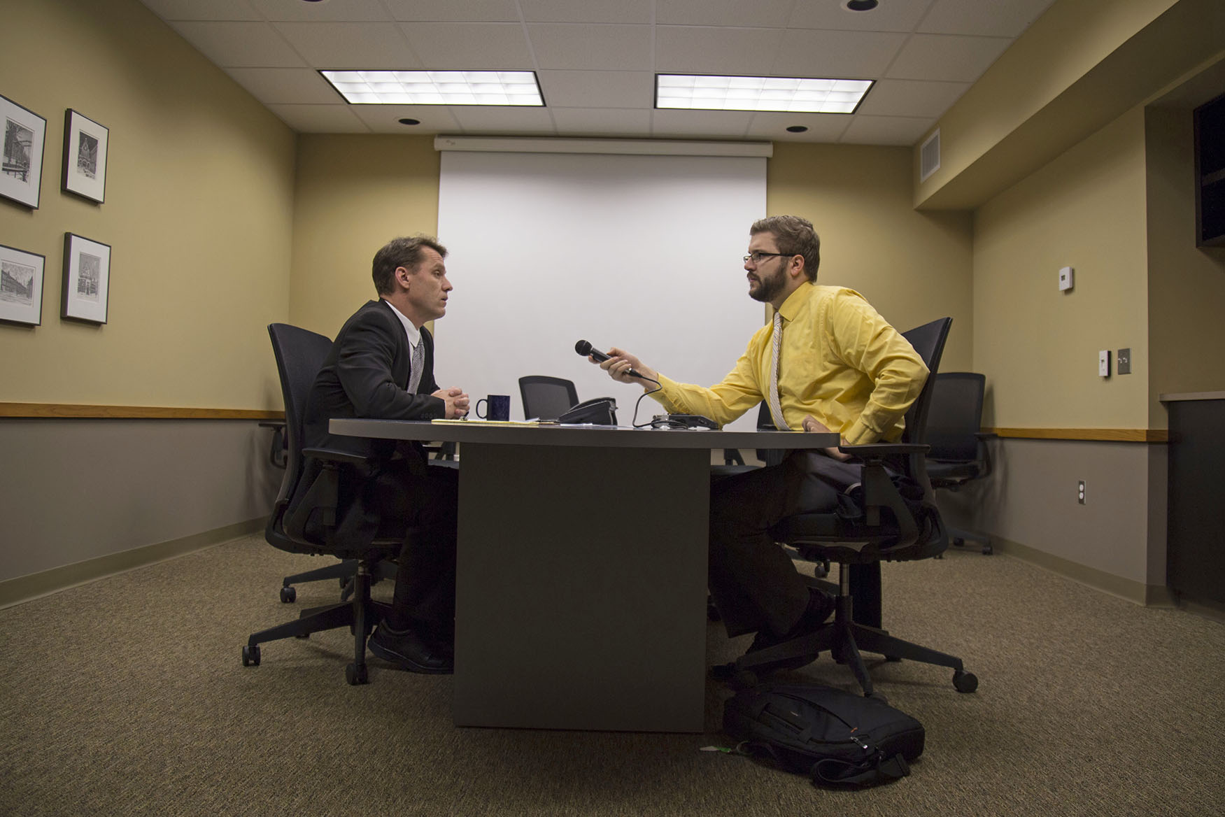 Andrew Schneider, ’13, interviews with Pella City Administrator Mike Nardini.