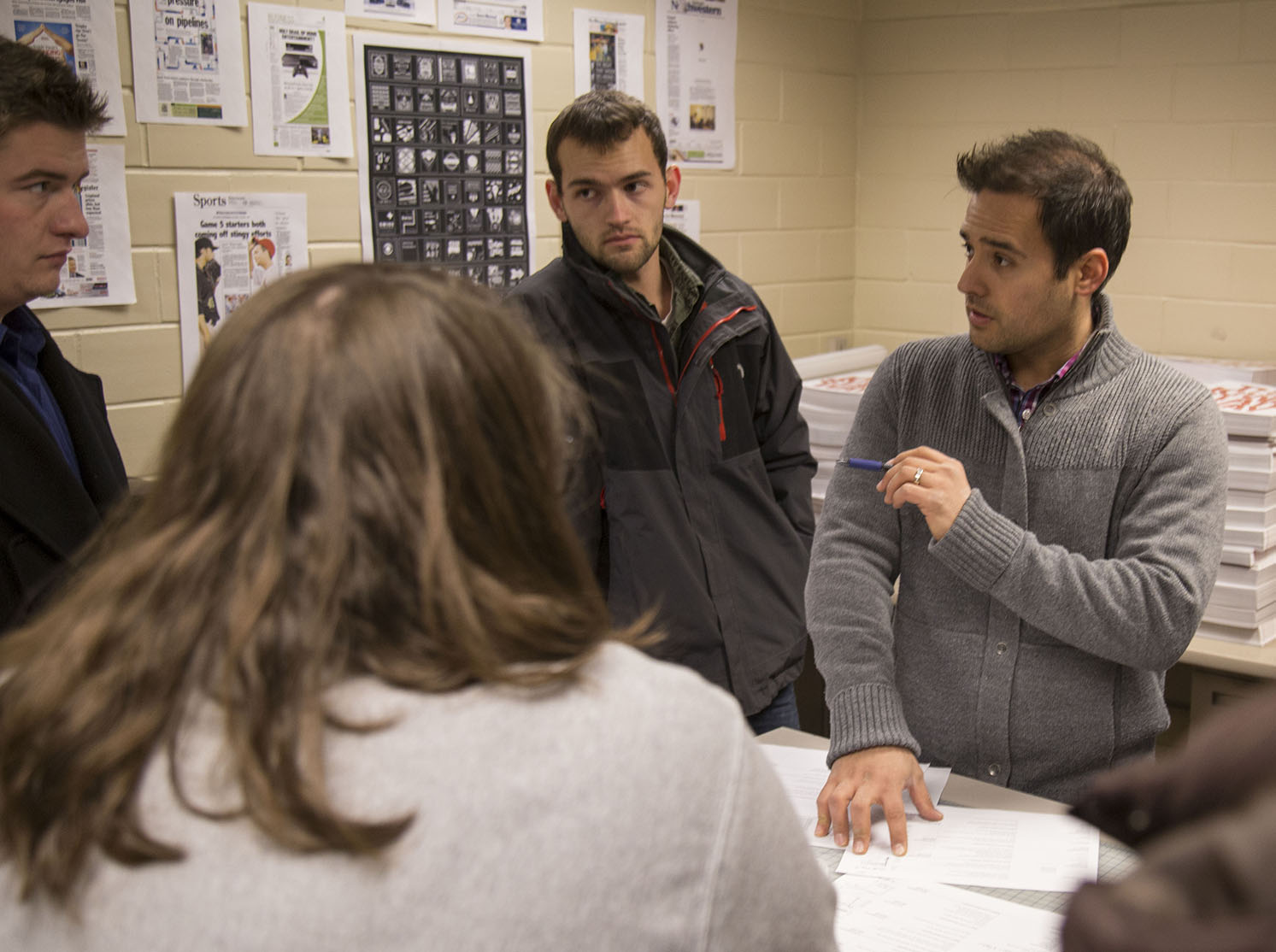 Cunningham meets with his team of students as they prepare to distribute the first edition of the Daily