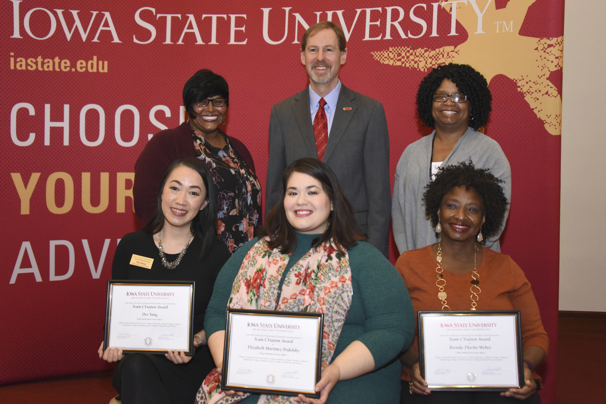 The multicultural liason officers pose with their awards.