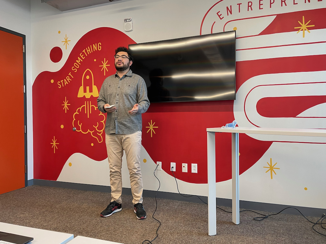 a student presents his ideas about entrepreneurship and innovation