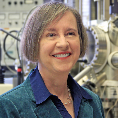 A portrait style photo of Patricia Thiel in front of lab equipment.