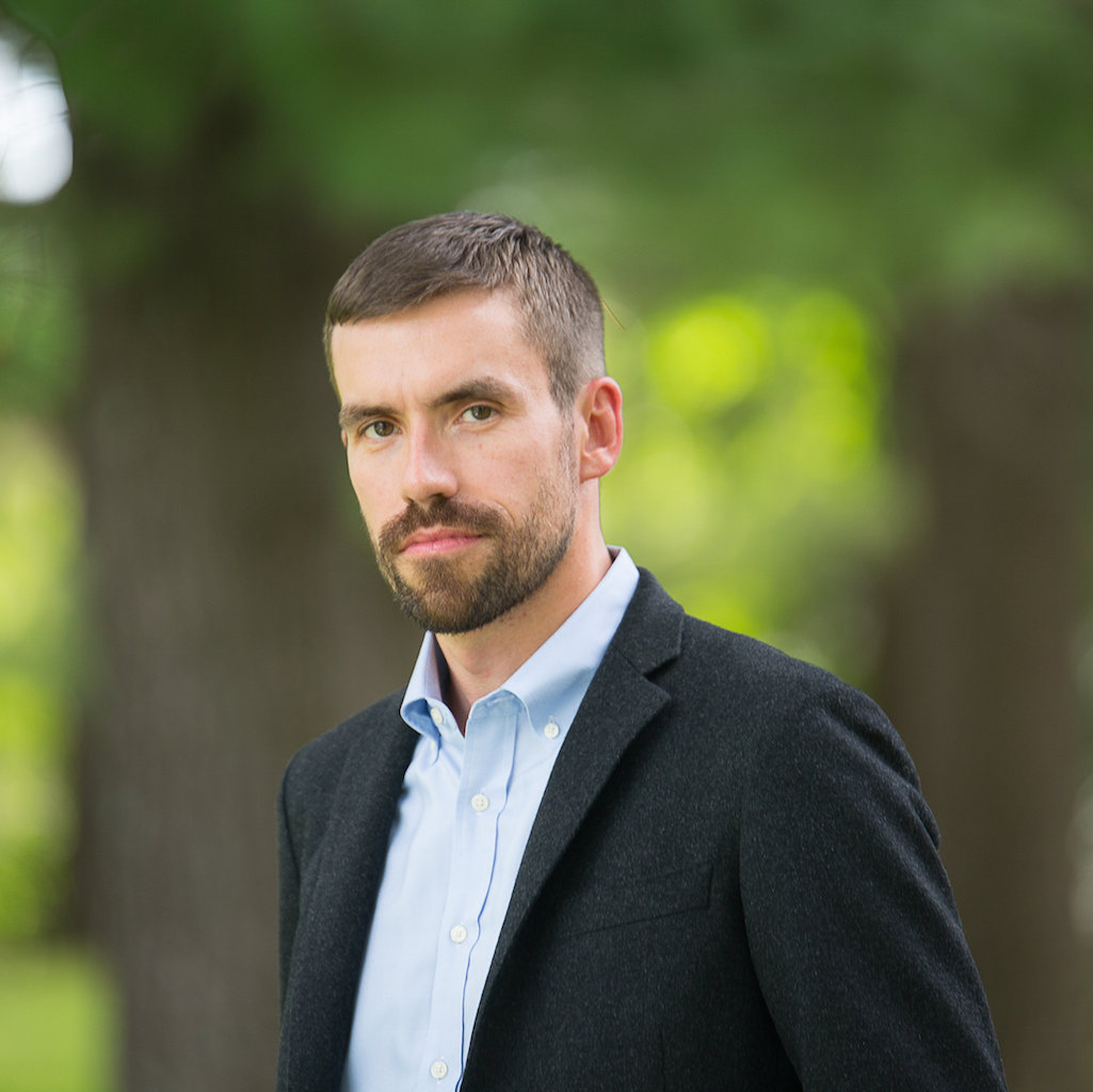 A portrait style photo of Chris Low, assistant professor of history.