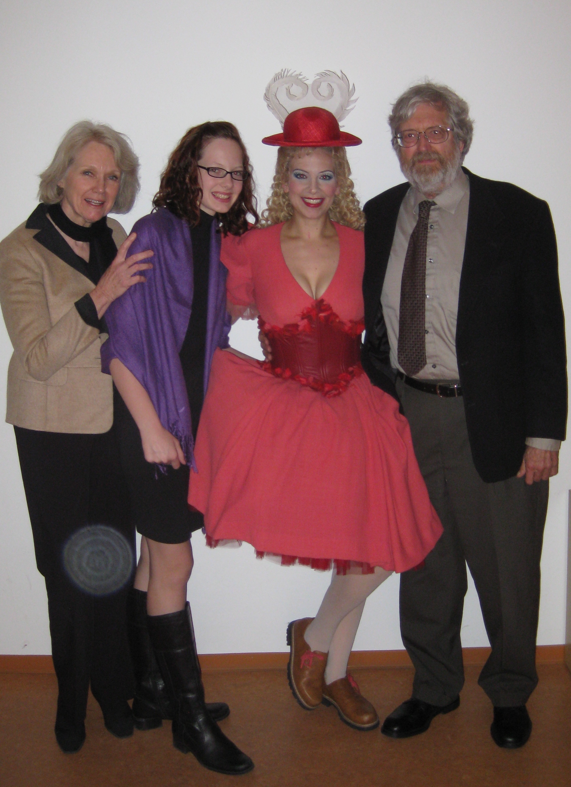 Jennifer Porto poses in a pink dress costume with Carl and Patricia Bleyle.