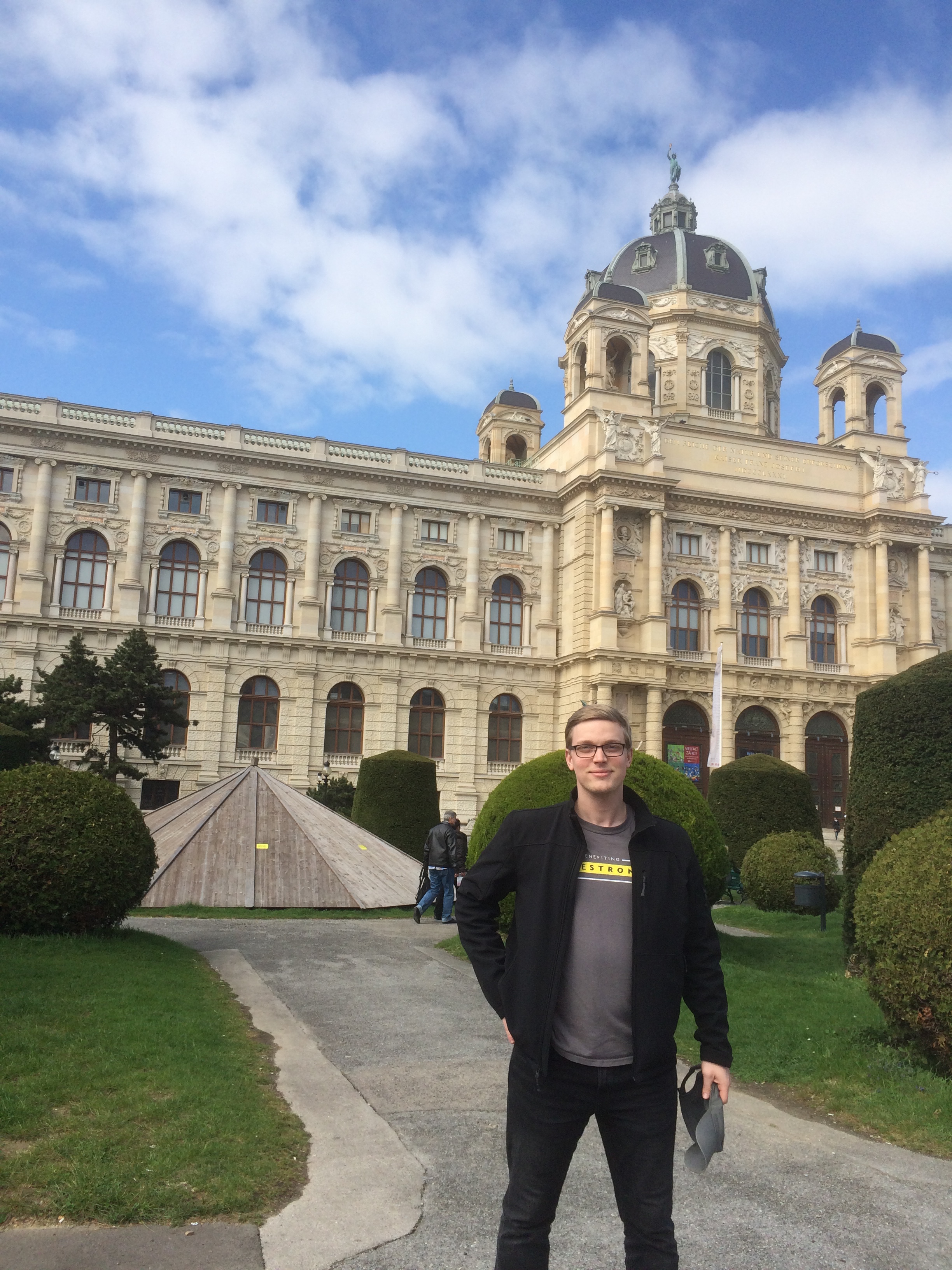 Student Nolan Shanks stands in front of the National Historical Building in Vienna, Austria.
