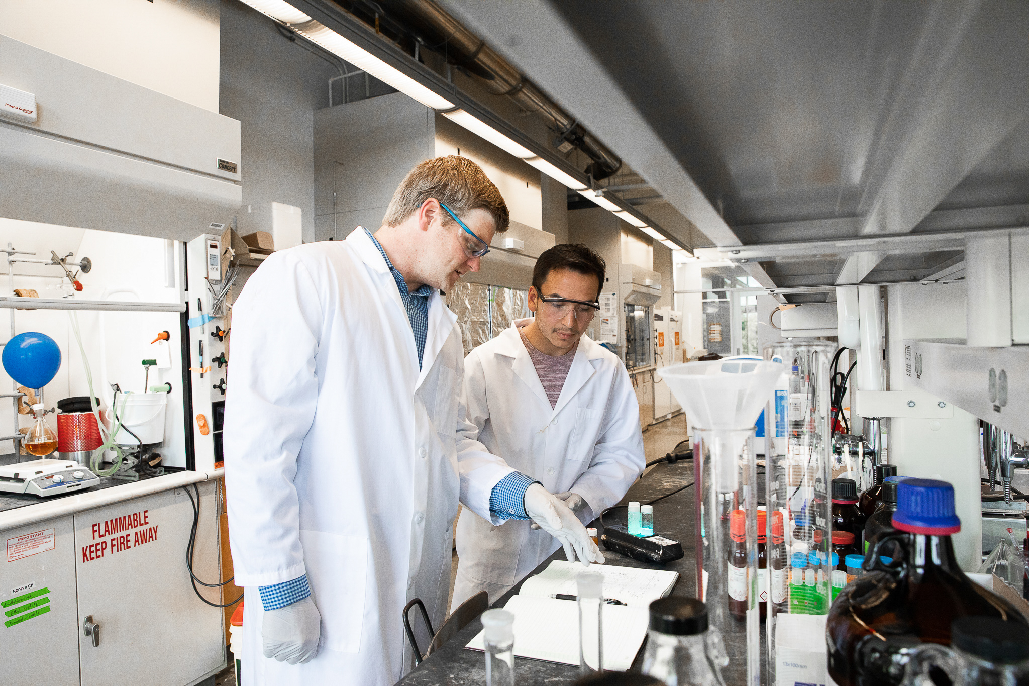 Student Danniel Arriaga works in the lab with Brett VanVeller, assistant professor of chemistry