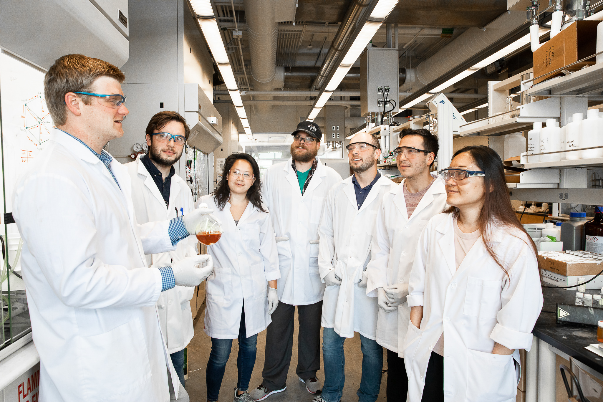 VanVeller and his team of student researchers discuss their research in the lab