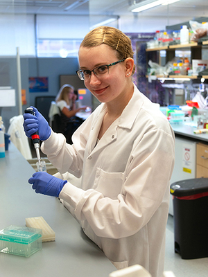 Student Sarah Zelle researches proteins in a lab