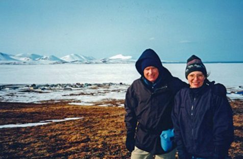 CDC scientist poses in an Alaskan landscape