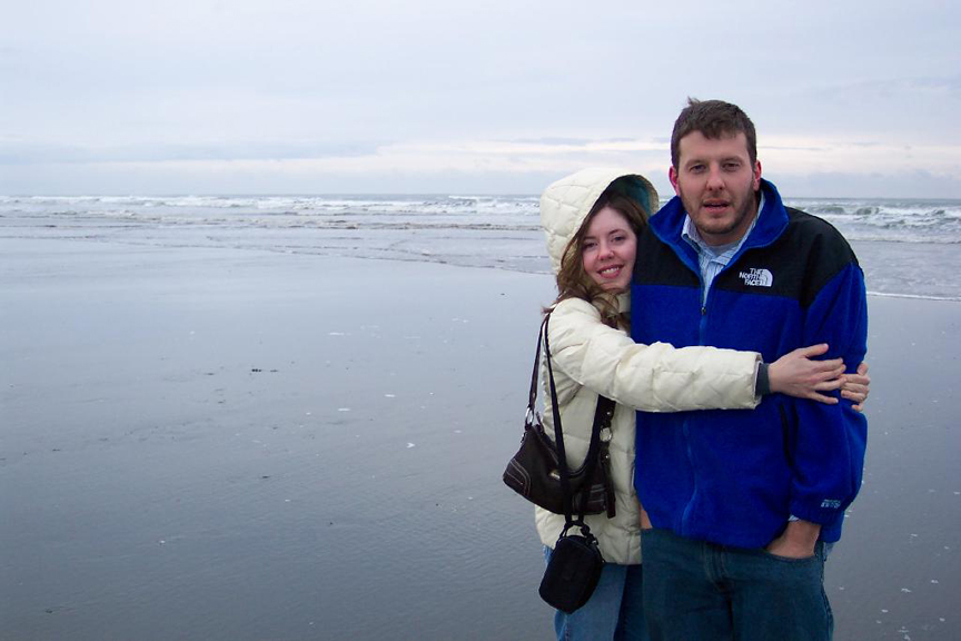Robbyn Anand stands with her brother near the ocean.
