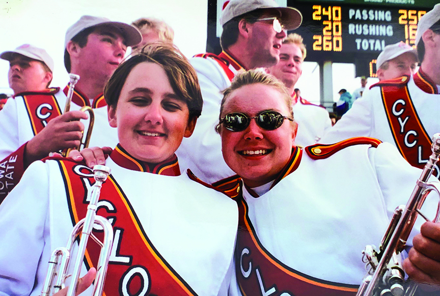 Jen Scharff as an Iowa State undergraduate, posing with marching band friends