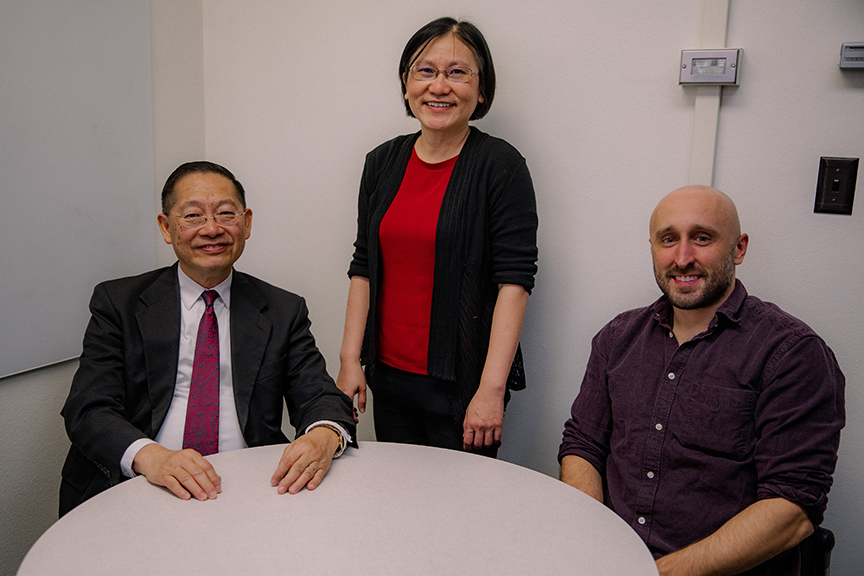 Wallapak Tavanapong poses with Computer Science Professor Emeritus, Johnny Wong and computer science graduate student, Jacob Pratt