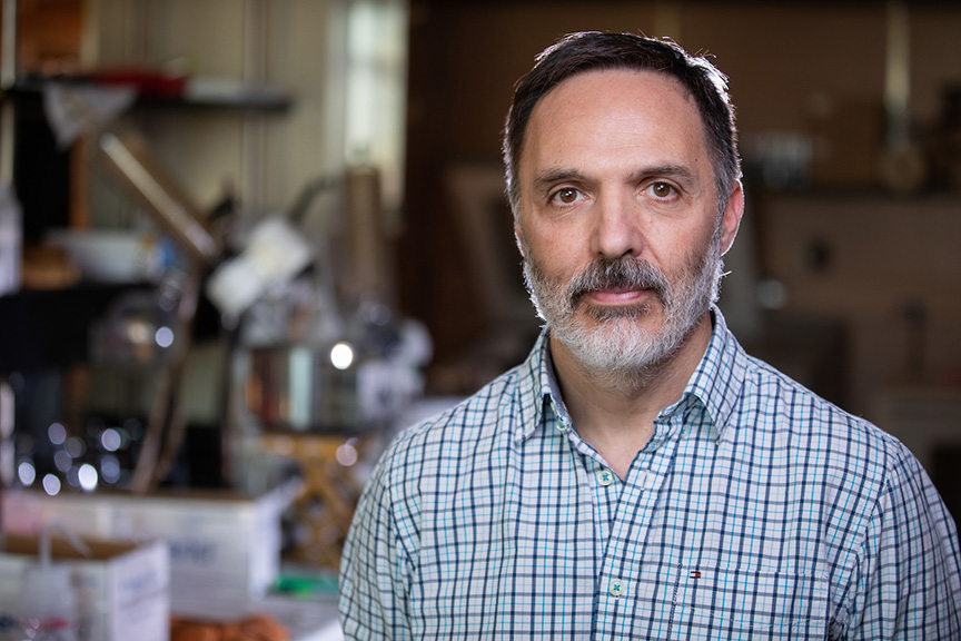 Gustavo MacIntosh poses in his research lab