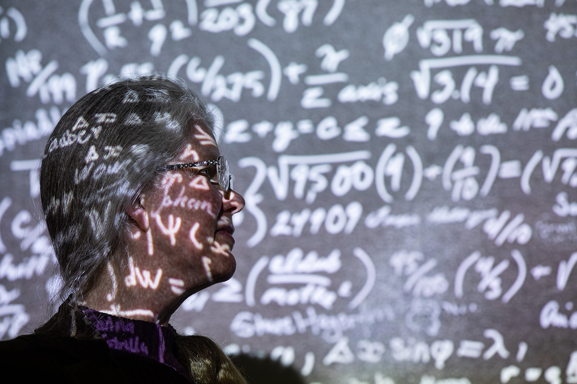 Theresa Windus surrounded by numbers and equations