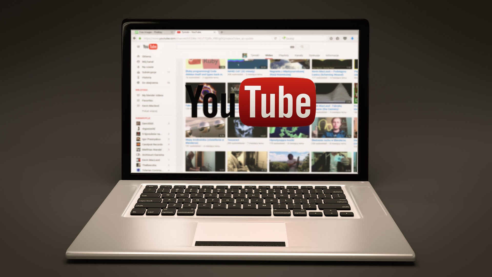 A laptop with youtube on the screen.