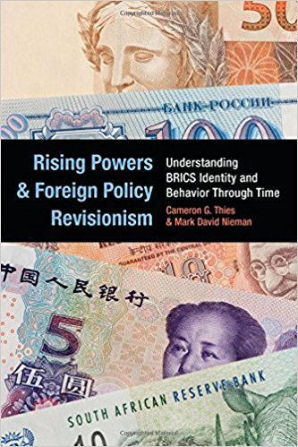 The cover of the book showing different currencies from different countries and the book title "Rising Powers and Foreign Policy Revisionism"