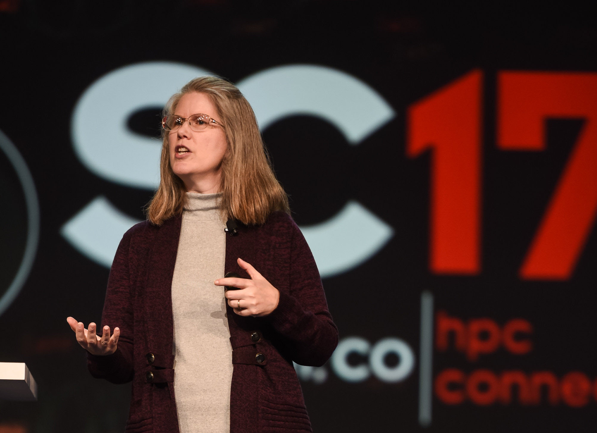 Theresa Windus talks on stage in front of the SC '17 backdrop.