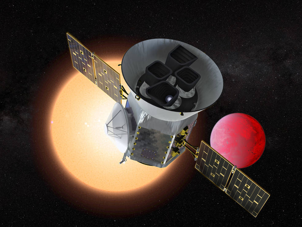 An illustration of a satellite in front of a large yellow sphere and a smaller red sphere.