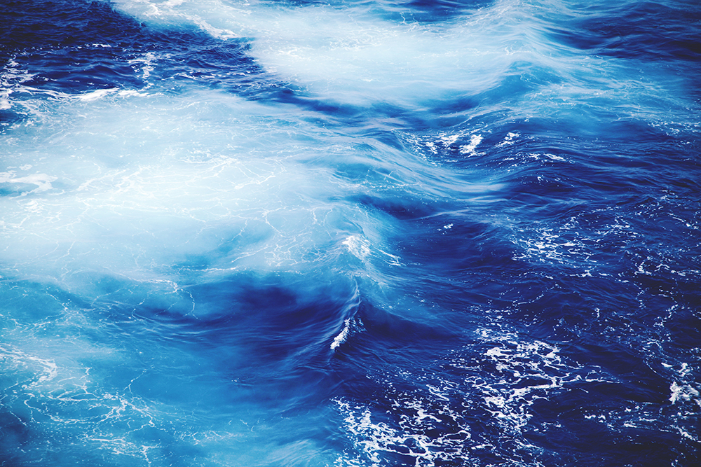 Blue ocean water in waves. Photo by Clem Onojeghuo on Unsplash