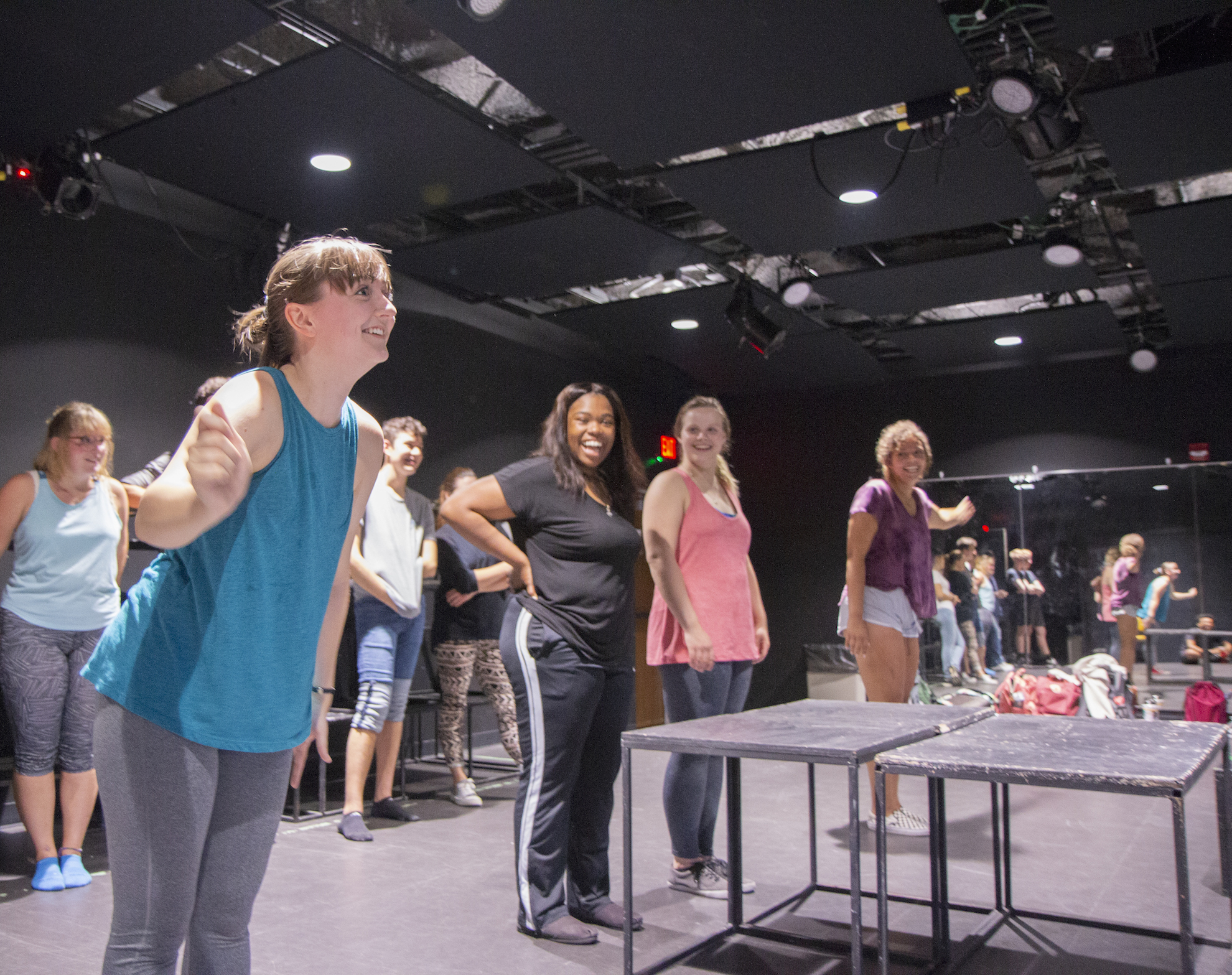 A student stands in a studio rehearsing a play.