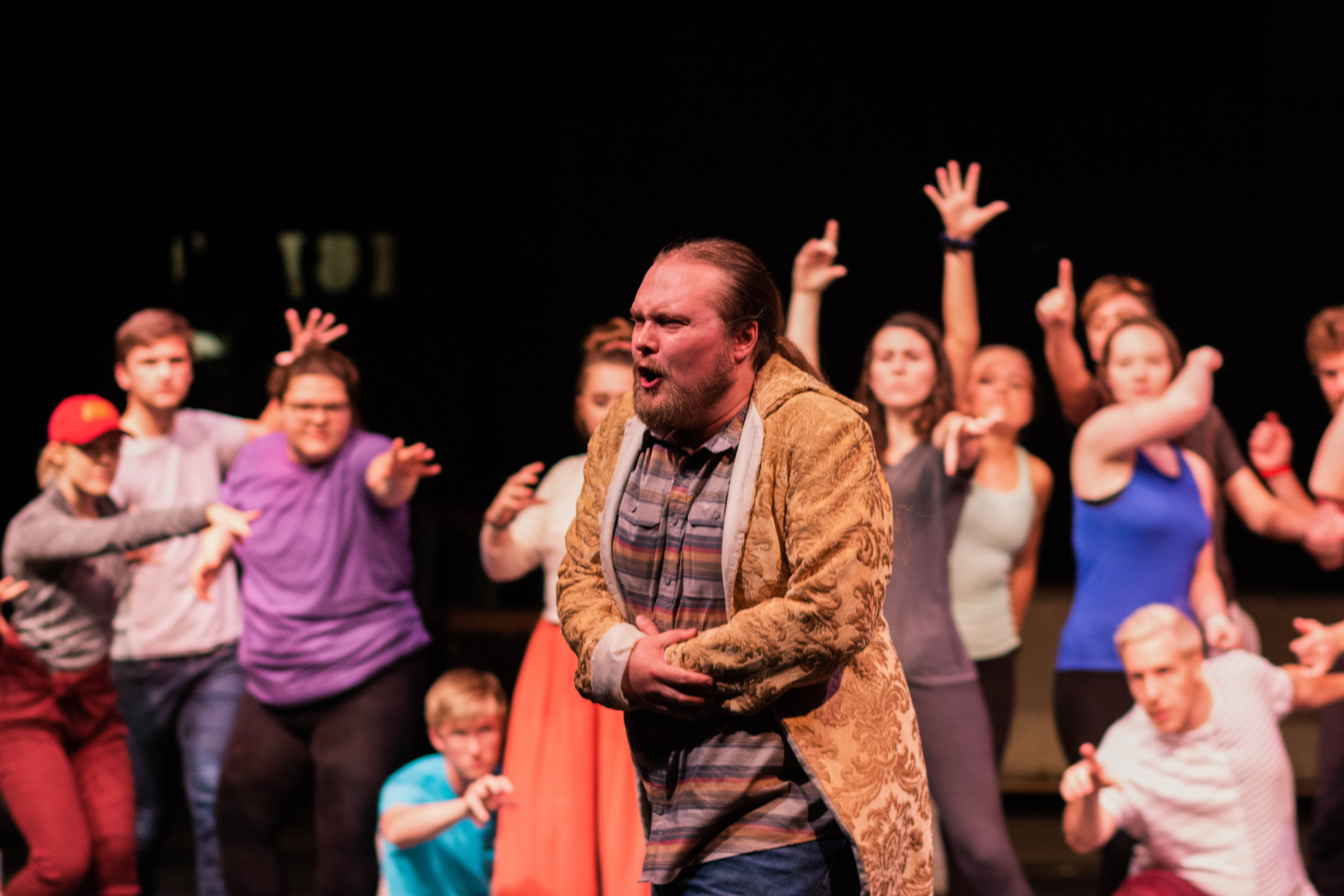 A student rehearse on stage at Fisher Theater.