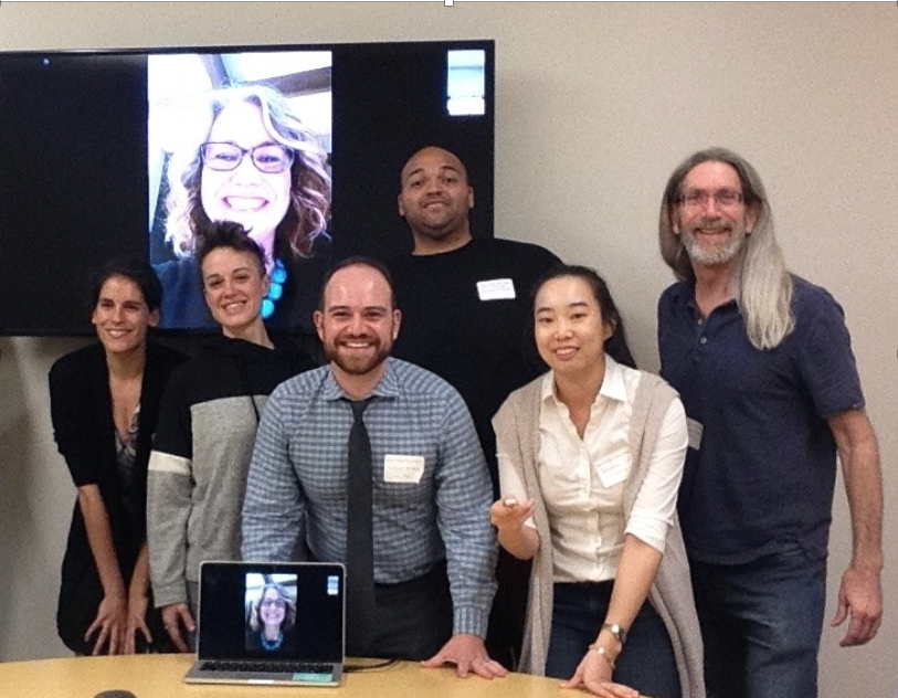 A group of people in a conference room.