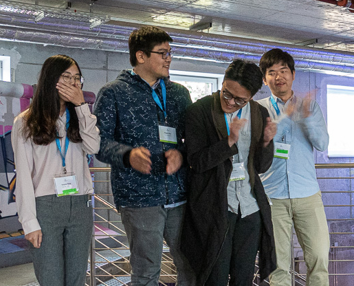 Students standing in a line after announcement of competition winners.