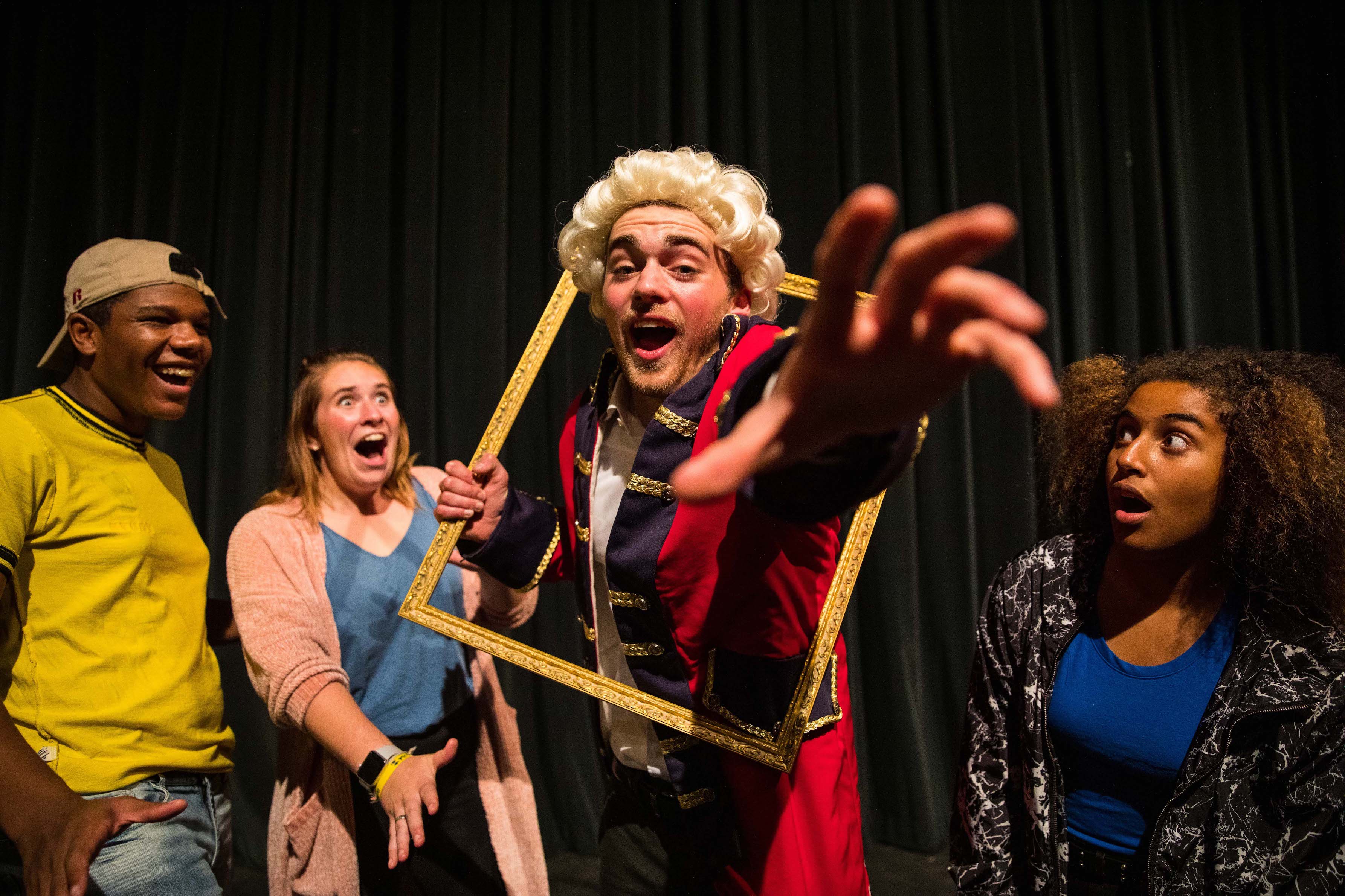 Students in costume on stage