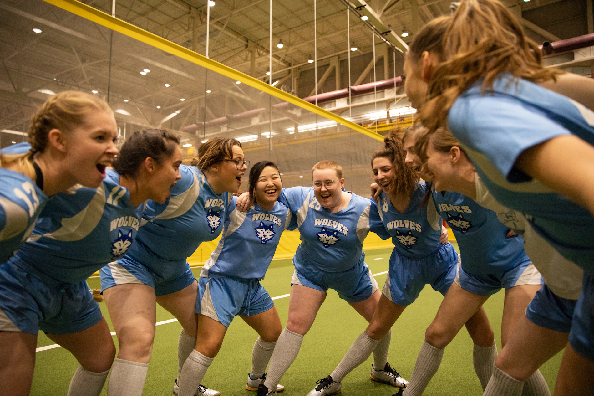 soccer players in a huddle