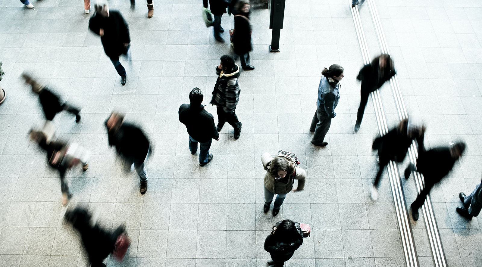 top-down view of people walking in a crowded area