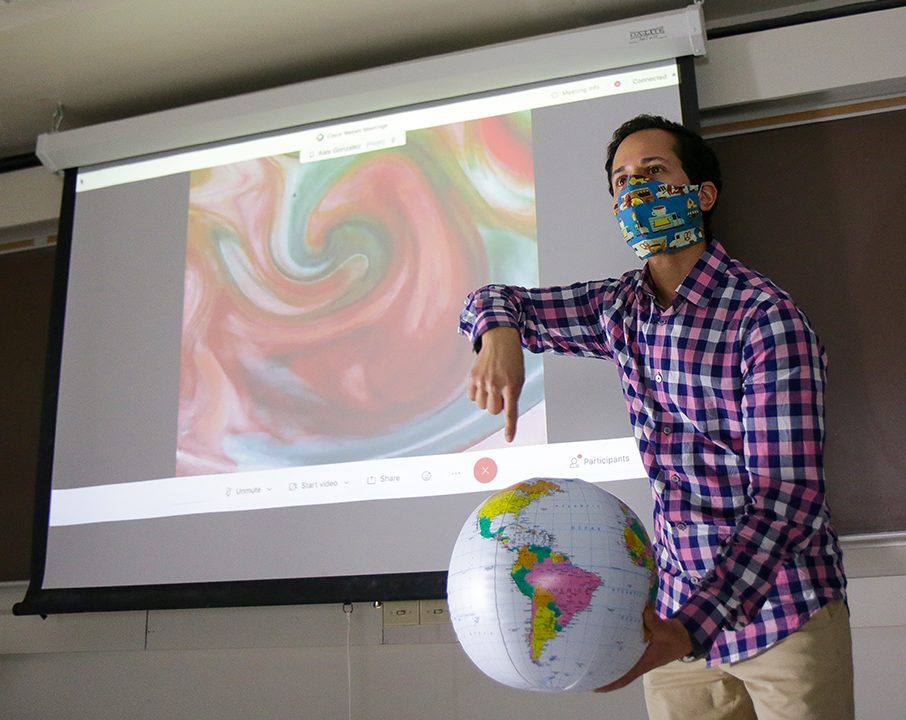 Alex Gonzalez gives a lecture about tropical weather