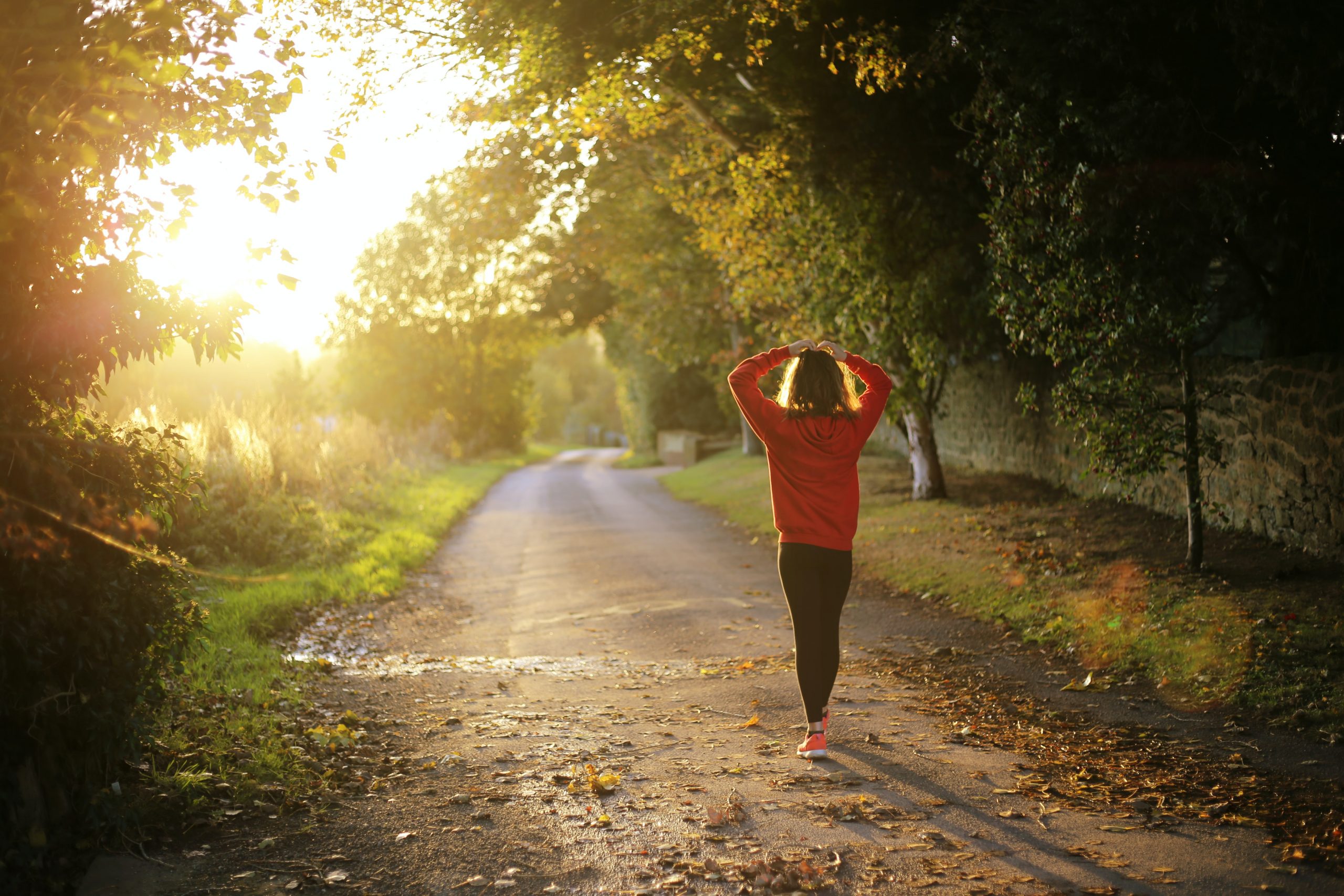 Woman walking on a country road