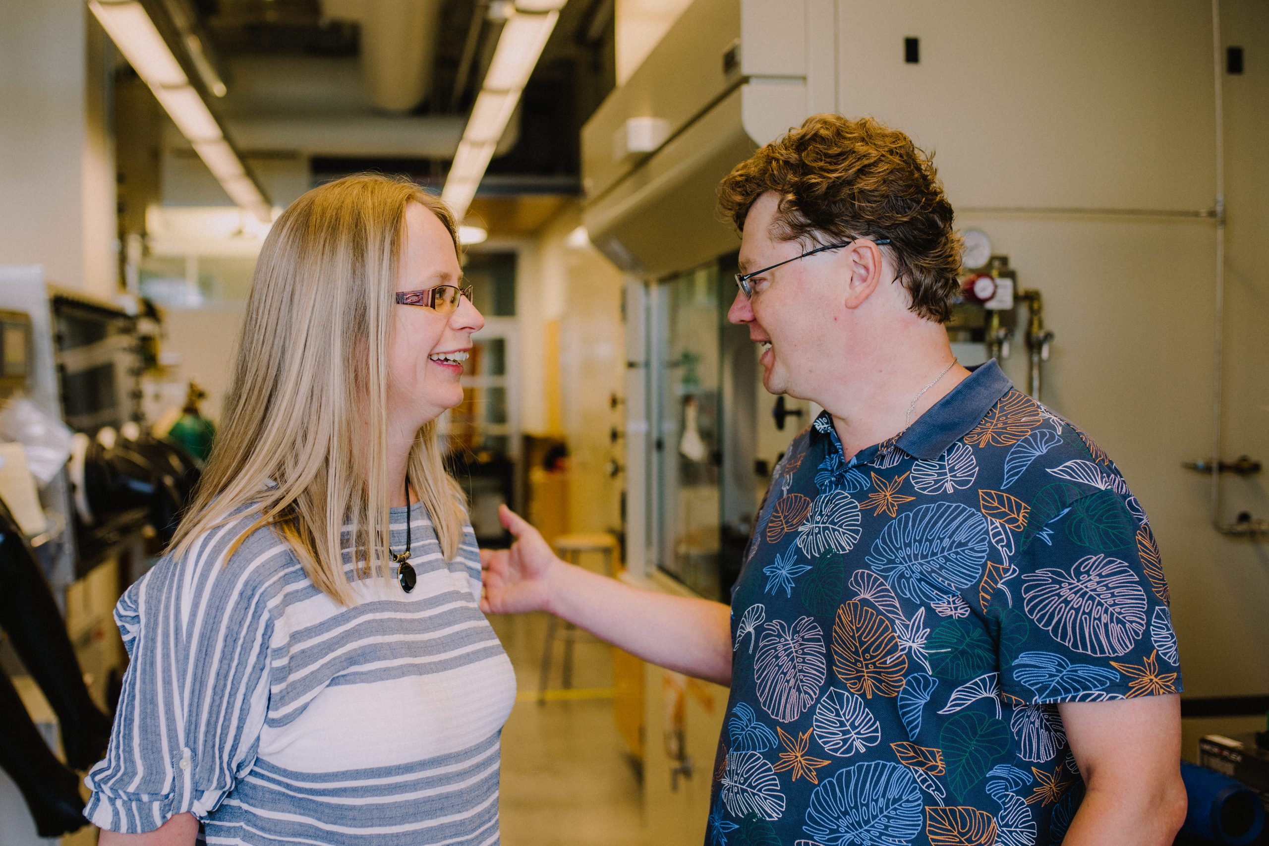Julia Zaikina and Kirill Kovnir have a lively conversation in the Zaikina chemistry lab