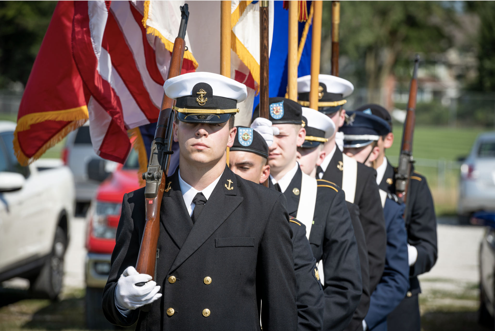 Members of ISU ROTC performing color guard, carrying flags