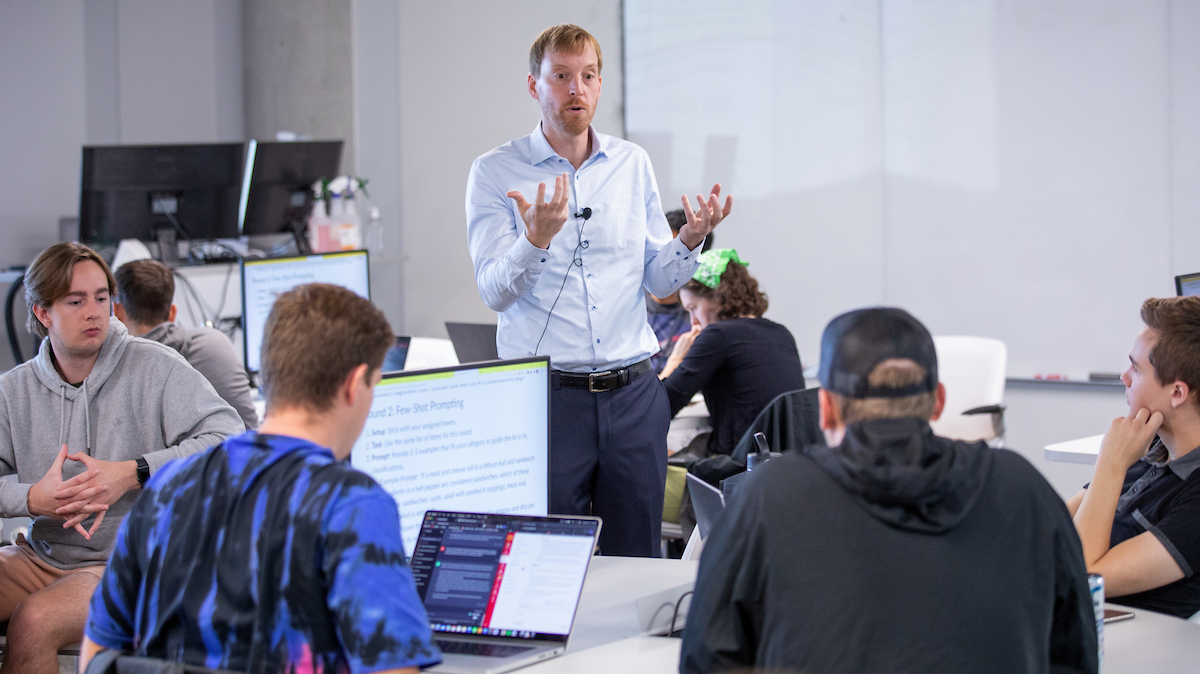 Abram Anders teaching in a classroom of students