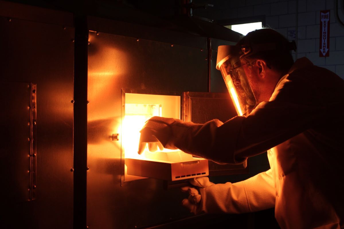 AAAS Fellow Paul Canfield removes a sample from a flux-growth furnace.