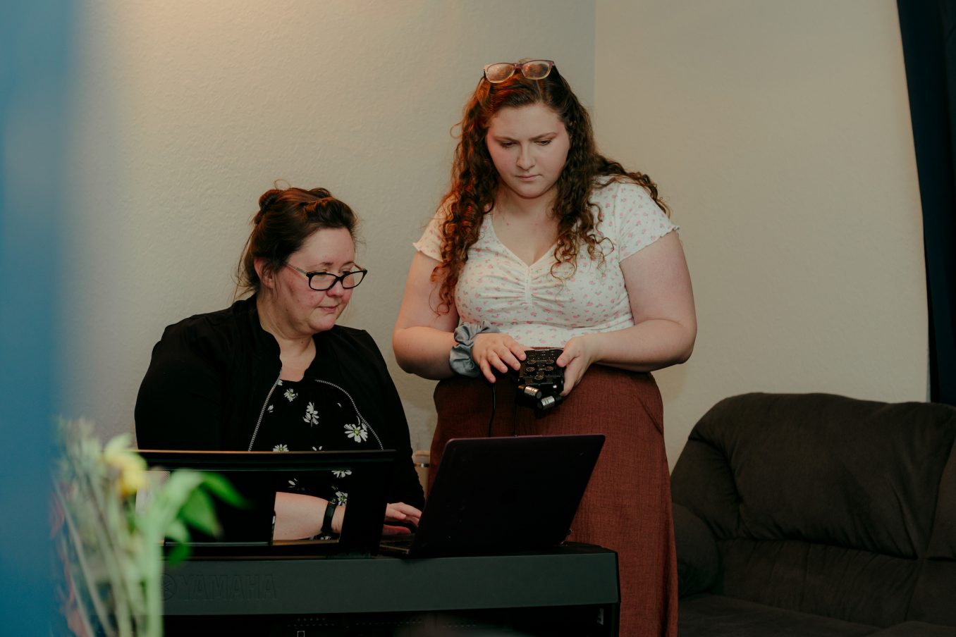 A student and professor collect research data at a music studio