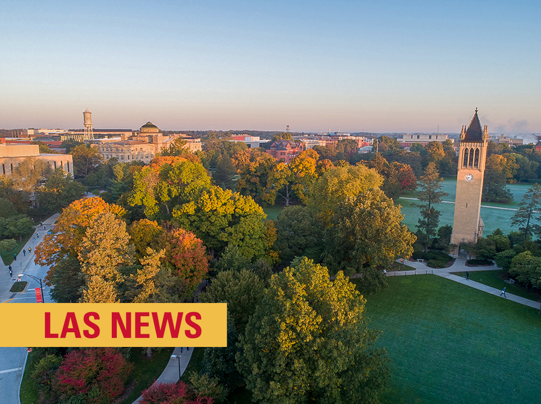 "Aerial view of Iowa State University's central campus during fall, with colorful autumn trees, the iconic Campanile clock tower, and campus buildings in the background. A red banner at the bottom reads 'LAS NEWS' in bold white letters.