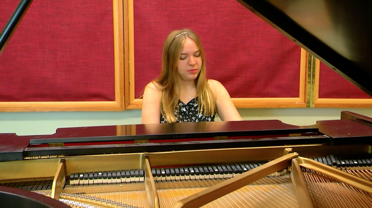 Ellie Lashier plays the piano