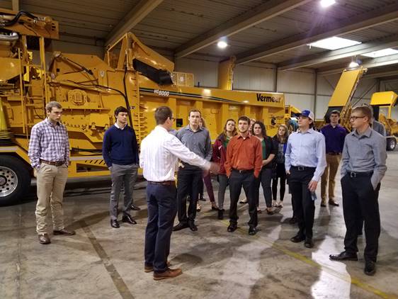 2016-17 cohort touring the Vermeer facility in Goes, Netherlands during their January 2017 trip.