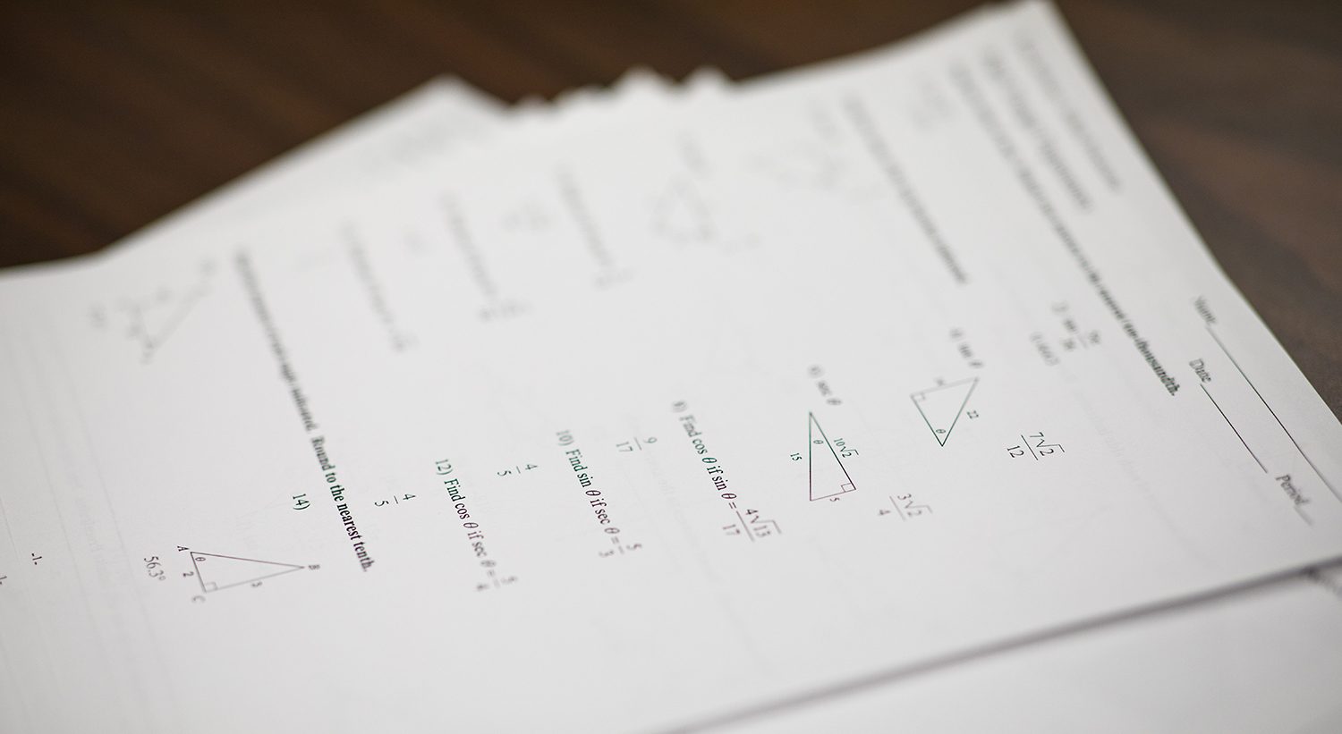 Math practice sheets on a table